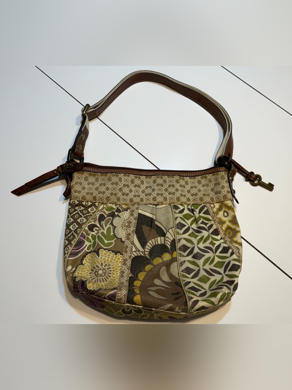 Fossil patchwork floral shoulder bag botanical pattern signature key charm